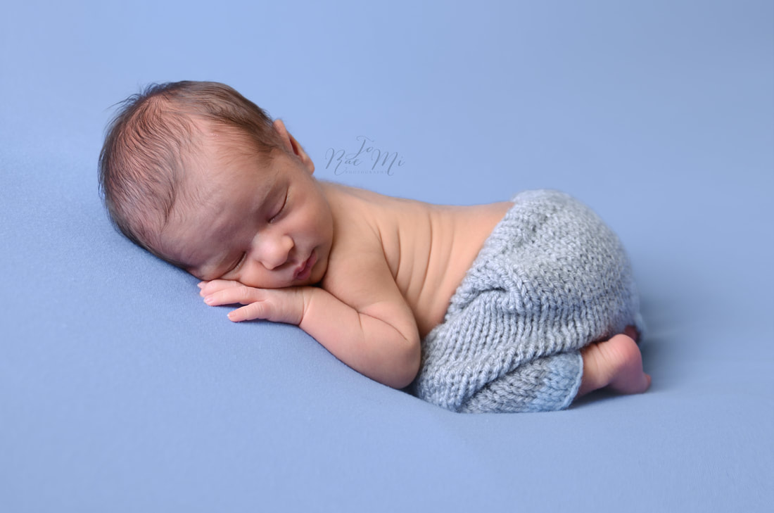 14 day old baby boy on a blue blanket {ontario newborn photographer}