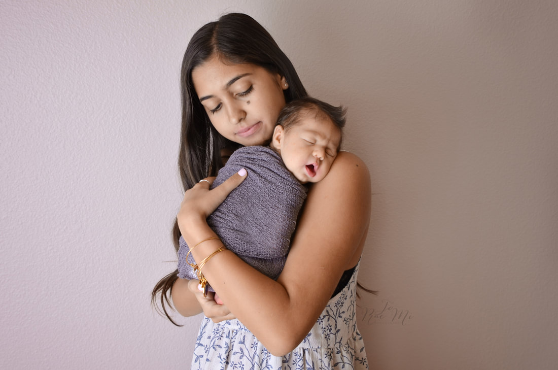 big sister snuggles with 24 day old baby brother {corona newborn photography}